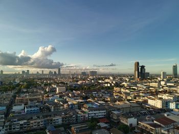 High angle view of buildings in city against sky