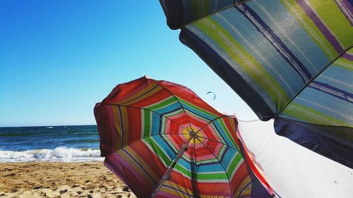 Built structure on beach against clear sky