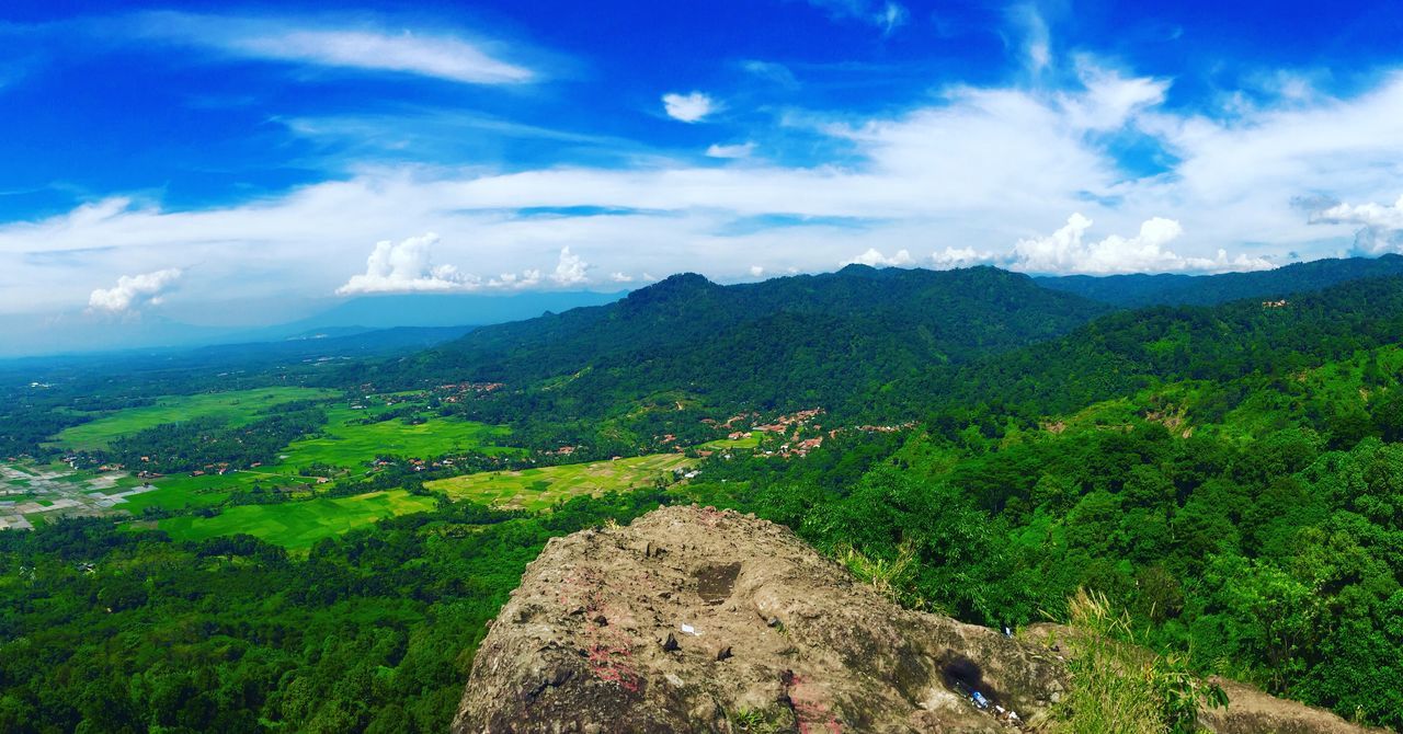 mountain, sky, tranquil scene, tranquility, scenics, landscape, beauty in nature, mountain range, green color, cloud - sky, nature, cloud, grass, non-urban scene, blue, idyllic, hill, plant, remote, growth, day, green, outdoors, cloudy, no people, non urban scene, horizon over land, lush foliage, majestic