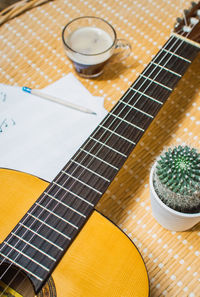 High angle view of guitar on table