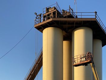 Low angle view of bridge against clear blue sky