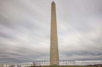 Low angle view of monument against cloudy sky