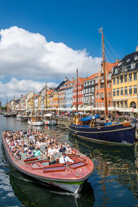 Tourist  cruise boat in famous nyhavn in copenhagen