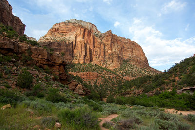 Scenic view of mountains against cloudy sky