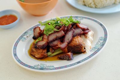 High angle view of char siu in plate on table