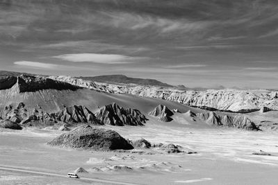 Scenic view of frozen landscape against sky