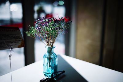 Close-up of flower vase on table