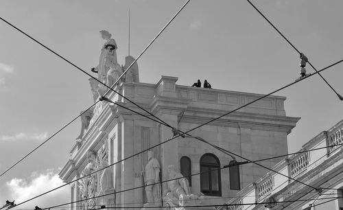 View of steel cables with statues