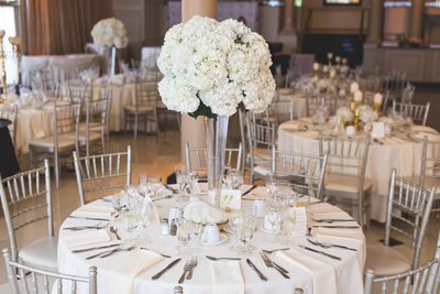 Flower vase on table in restaurant