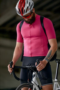 Midsection of man riding bicycle