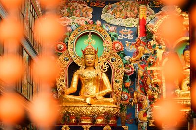 Statue in temple outside building