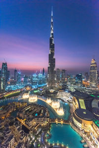 Aerial view of illuminated buildings in city