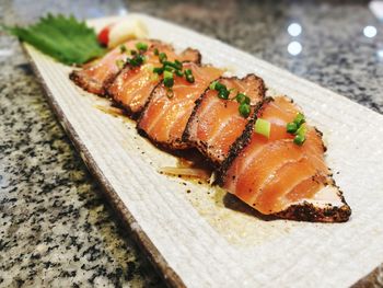 Close-up of serving fish on table