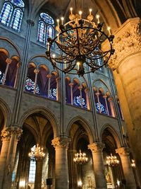 Low angle view of illuminated chandelier in building
