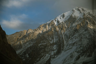 Close-up of rock formation against sky