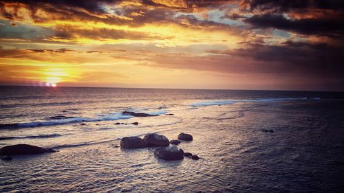 Scenic view of sea against cloudy sky