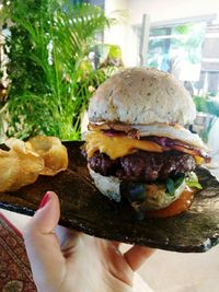 Close-up of hand holding ice cream