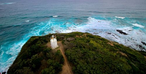 High angle view of people looking at sea