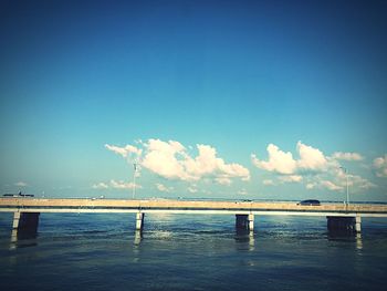 View of wooden posts in sea