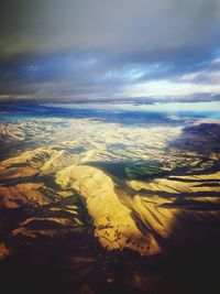 Aerial view of agricultural landscape against sky