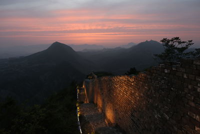 Scenic view of mountains against sky during sunset