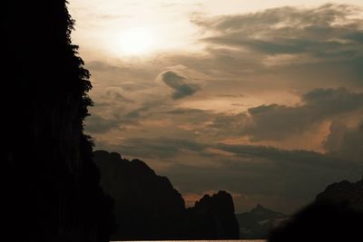 Low angle view of silhouette mountain against sky during sunset