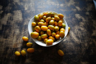 Directly above shot of tomatoes in bowl on table