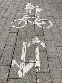 High angle view of arrow sign on road