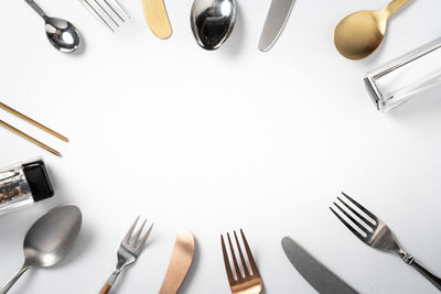 High angle view of objects on table against white background