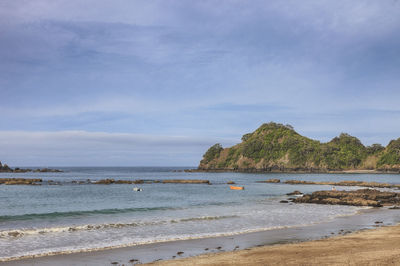 Scenic view of beach against sky