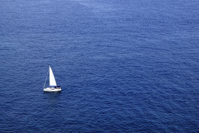 High angle view of sailboat sailing in sea