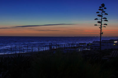 Scenic view of sea against sky at sunset