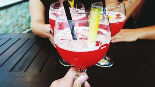 Close-up of friends with cocktail glasses