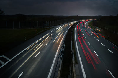 High angle view of light trails on road at night