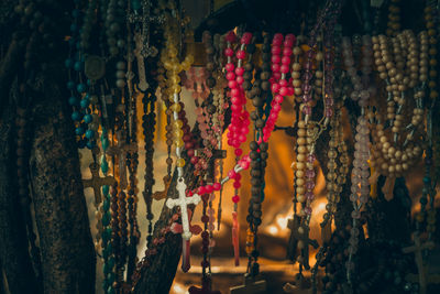 Close-up of bead necklaces hanging at market