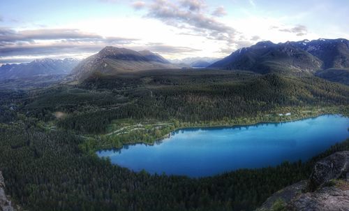 Scenic view of lake and mountains against sky