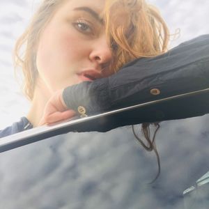 Portrait of young woman looking at camera