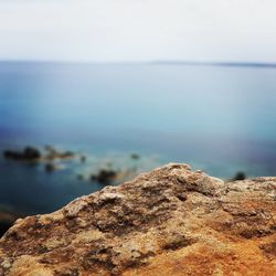 Close-up of rock against sea