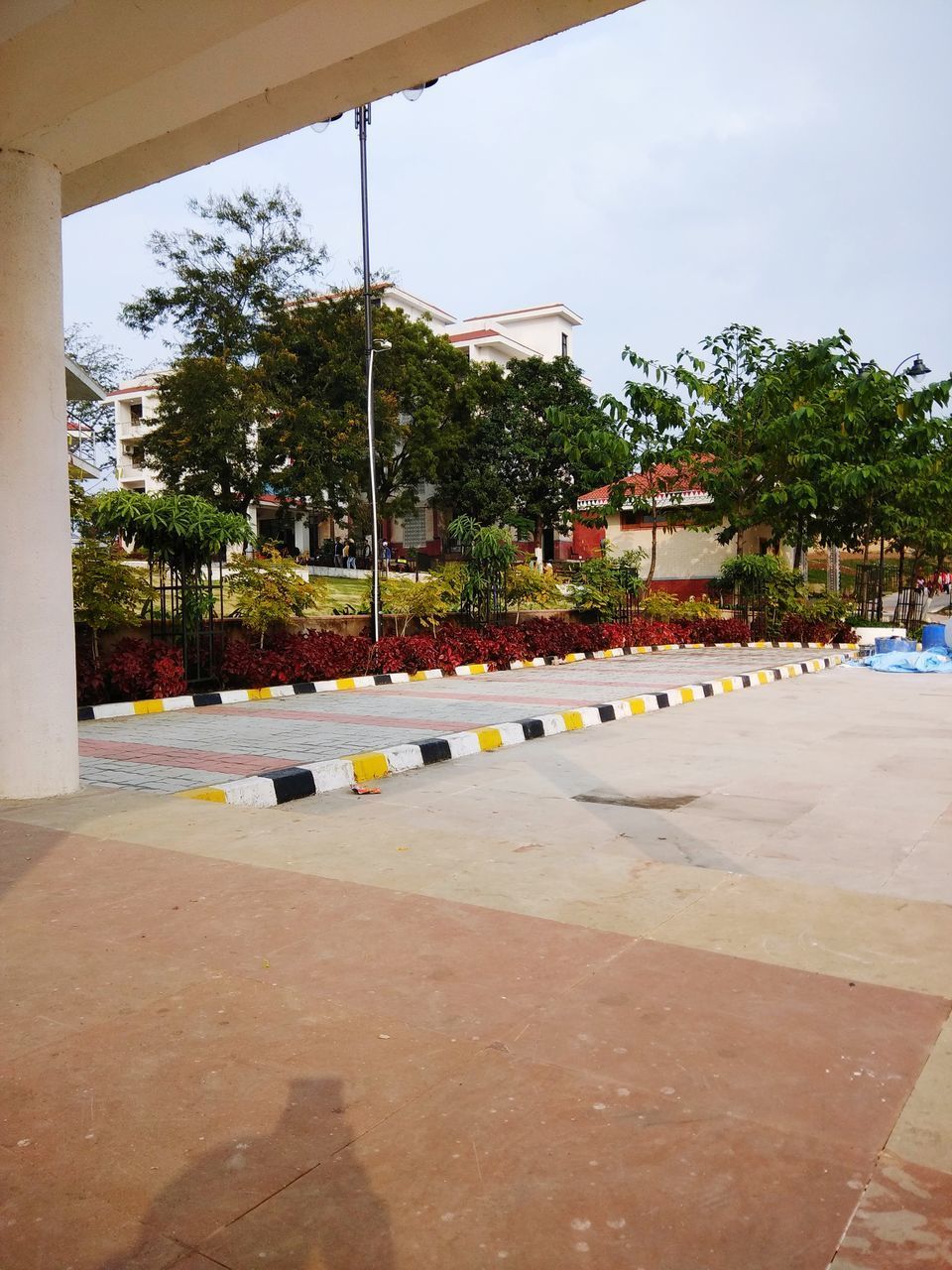 ROAD BY SWIMMING POOL AGAINST SKY