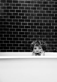 Portrait of boy in bath