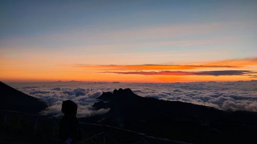 Scenic view of silhouette mountain against sky during sunset