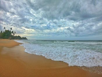 Scenic view of beach against sky