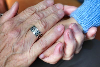 Close-up of couple holding hands