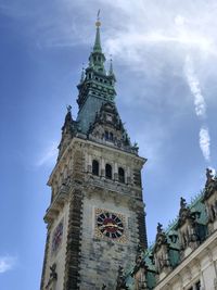 Low angle view of clock tower against sky