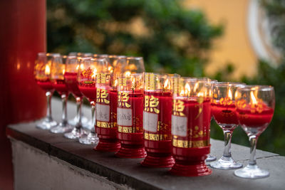 Close-up of illuminated candles on table