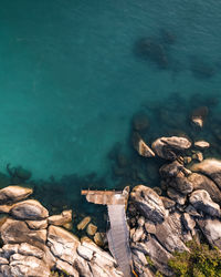 High angle view of rocks in sea