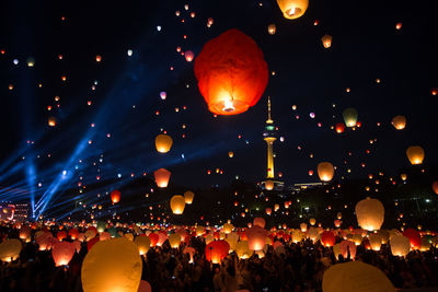 Group of people in the sky at night