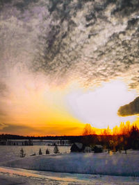 Scenic view of landscape against sky during sunset