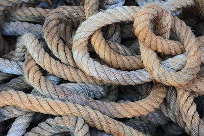 Full frame shot of rope tied on wood