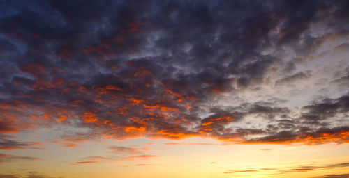 Low angle view of dramatic sky during sunset